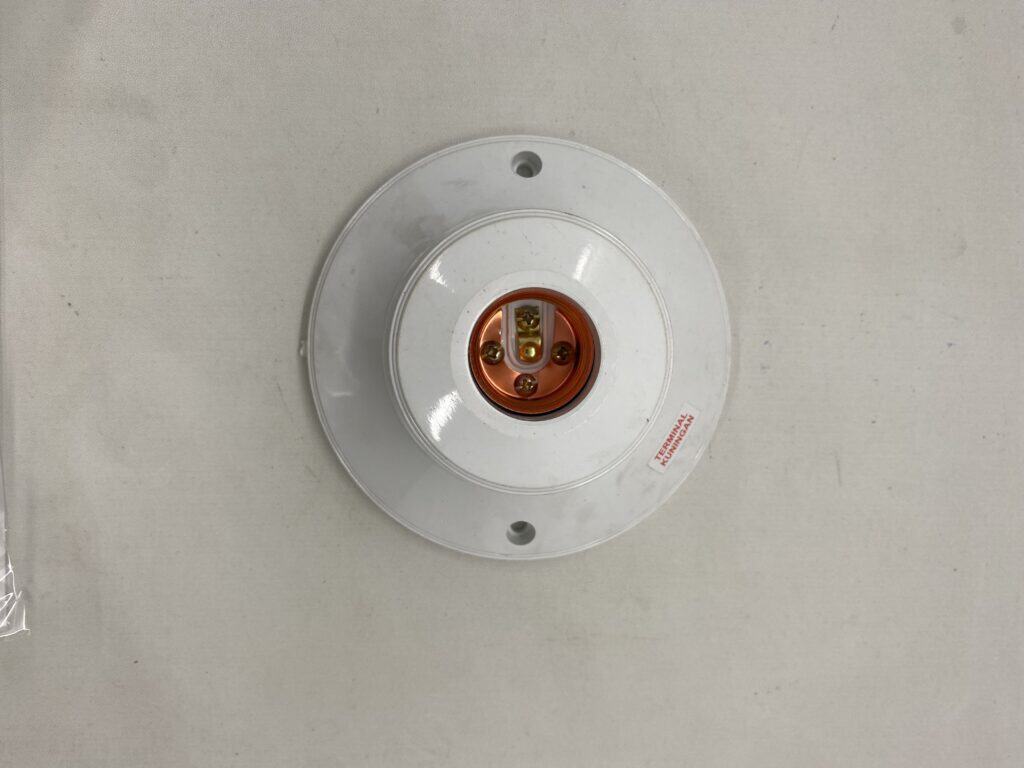 Electrical outlet fitting for wall installation.