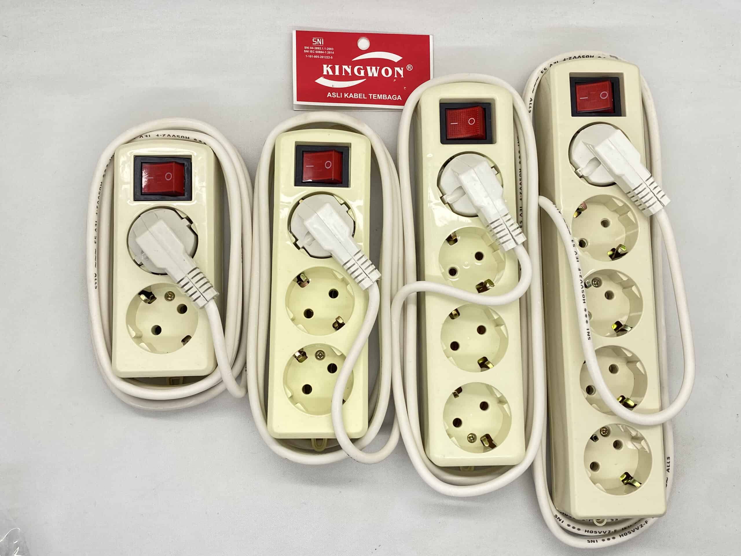Power strip with multiple sockets and connected cables for electrical devices.