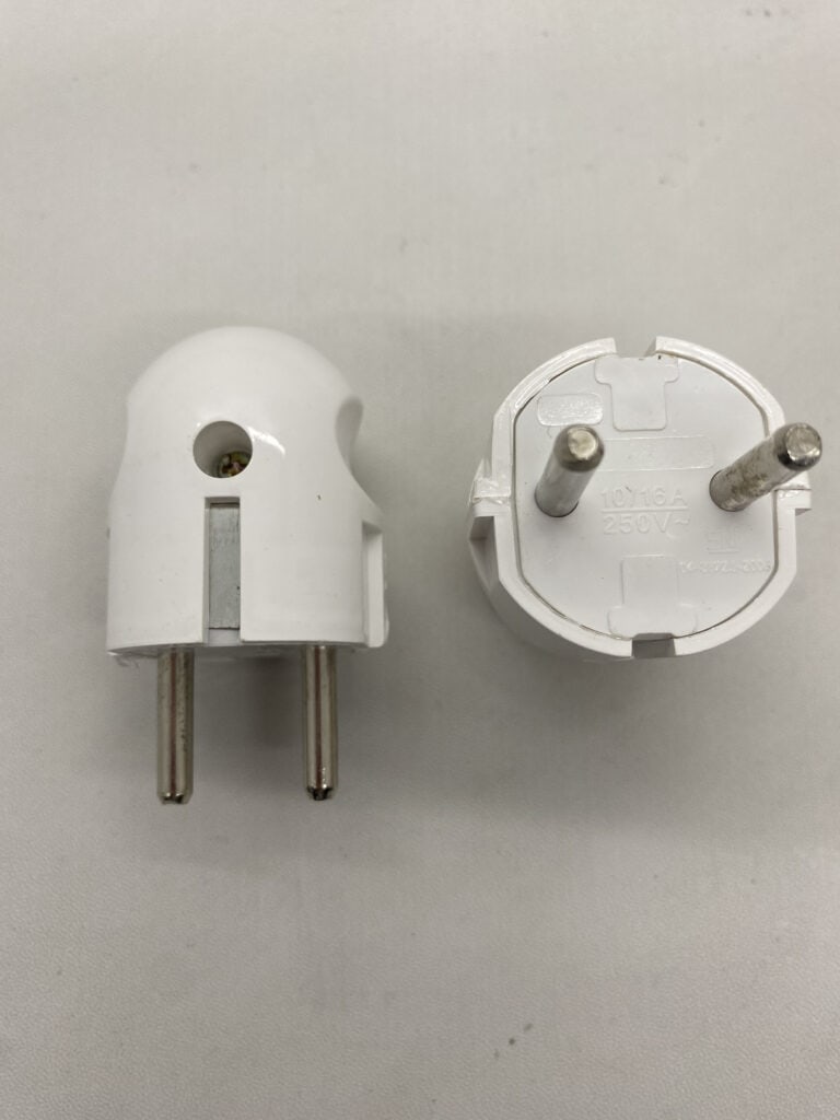 Power plug adapter with two metal pins for electrical connection.