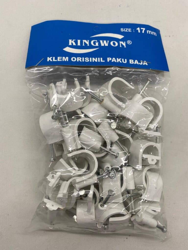 White cable clamps for secure electrical wiring installation.