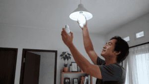 Mengganti lampu biasa dengan lampu LED agar lebih hemat listrik